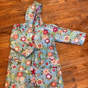 Kids raincoat, warm interior, size 4T/5T. 3rd snap is missing.